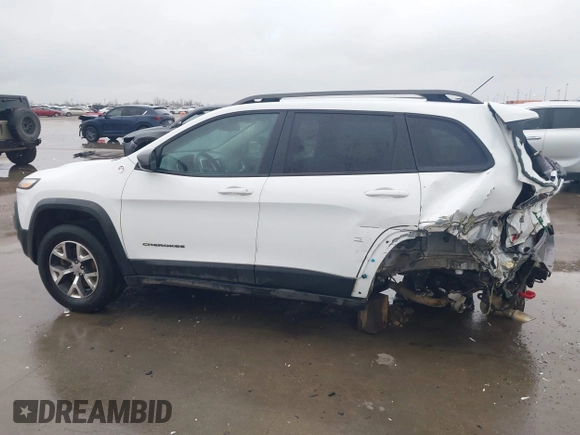 2015 Jeep Cherokee Trailhawk with VIN 1C4PJMBB1FW630519, listed as a IAAI auction lot 41605466 with 219,390 mi miles and . Bid and sale history available at carsss.com. Image 15.