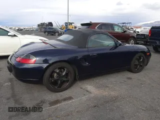 2000 Porsche Boxster z VIN WP0CA2981YU626756, wystawiony jako Copart lot #51706035 z przebiegiem 117 369 mil mil oraz Czysty tytuł • Clean title. Historia ofert i sprzedaży dostępna na DreamBid. Obrazek 3.