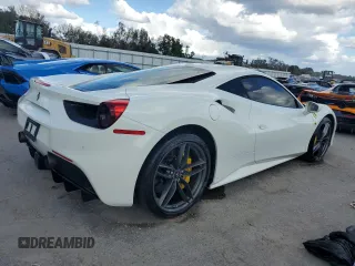 2016 Ferrari 488 z VIN ZFF79ALAXG0216223, wystawiony jako Copart lot #74210804 z przebiegiem Nie podano mil oraz Szkody całkowita. Historia ofert i sprzedaży dostępna na DreamBid. Obrazek 3.