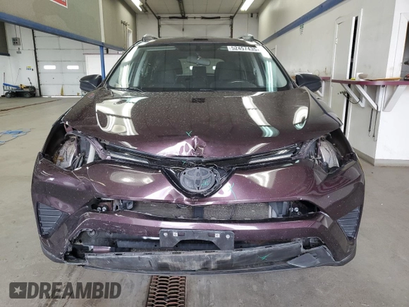 2016 Toyota RAV4 LE with VIN 2T3BFREV3GW490181, listed as a Copart auction lot 52457435 with 128,267 mi miles and Salvage Title. Bid and sale history available at DreamBid. Image 5.