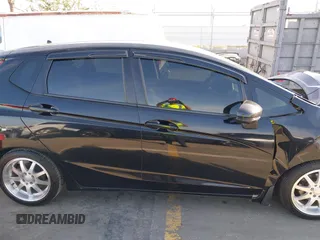2015 Honda Fit LX z VIN 3HGGK5H57FM717203, wystawiony jako IAAI lot #41615075 z przebiegiem 99 933 mil mil oraz . Historia ofert i sprzedaży dostępna na DreamBid. Obrazek 13.