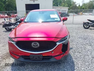 2021 Mazda CX-5 Grand Touring with VIN JM3KFBDM3M0434569, listed as a IAAI auction lot 42422349 with 25,924 mi miles and . Bid and sale history available at DreamBid. Image 6.