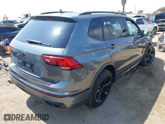 2023 Volkswagen Tiguan SE R-Line Black with VIN 3VVCB7AX8PM036684, listed as a IAAI auction lot 42169004 with 25,024 mi miles and . Bid and sale history available at DreamBid. Image 4.