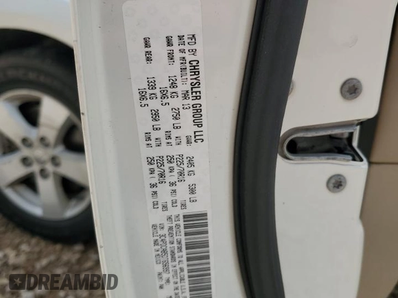 2013 Dodge Journey American Value with VIN 3C4PDCAB5DT656997, listed as a Copart auction lot 57123565 with 201,799 mi miles and Salvage title. Bid and sale history available at DreamBid. Image 14.