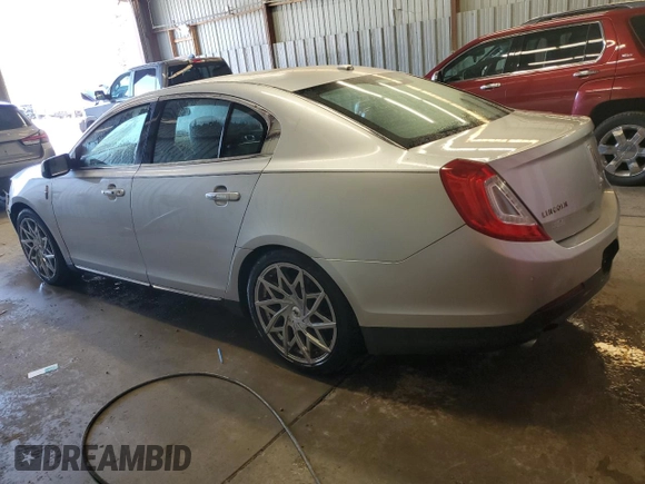2013 Lincoln MKS z VIN 1LNHL9EK0DG605184, wystawiony jako Copart lot #51914305 z przebiegiem 173 117 mil mil oraz Szkoda całkowita • Salvage title. Historia ofert i sprzedaży dostępna na DreamBid. Obrazek 2.