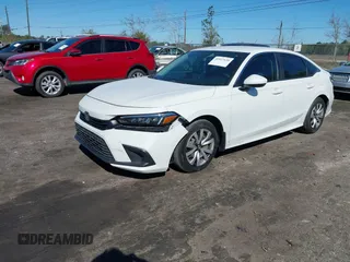 2022 Honda Civic Sedan LX with VIN 2HGFE2F26NH545818, listed as a IAAI auction lot 41817630 with 28,650 mi miles. Bid and sale history available at carsss.com. Image 2.