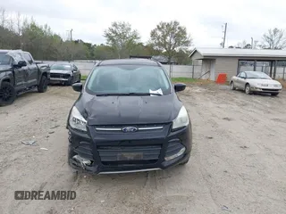 2016 Ford Escape SE with VIN 1FMCU9G99GUC13053, listed as a IAAI auction lot 41888535 with 84,019 mi miles. Bid and sale history available at carsss.com. Image 12.