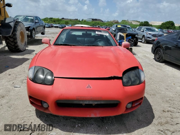 1999 Mitsubishi 3000GT GT z VIN JA3AM84J4XY001608, wystawiony jako Copart lot #64366944 z przebiegiem 153 804 mil mil oraz Tytuł czysty. Historia ofert i sprzedaży dostępna na DreamBid. Obrazek 5.