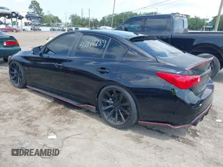 2015 Infiniti Q50 Premium z VIN JN1BV7AR8FM398319, wystawiony jako IAAI lot #42170789 z przebiegiem 86 108 mil mil oraz . Historia ofert i sprzedaży dostępna na DreamBid. Obrazek 3.