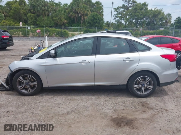2018 Ford Focus SE z VIN 1FADP3FE4JL214013, wystawiony jako IAAI lot #42180138 z przebiegiem 72 550 mil mil oraz . Historia ofert i sprzedaży dostępna na DreamBid. Obrazek 14.