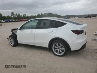 2023 Tesla Model Y Long Range z VIN 7SAYGDEE0PF802511, wystawiony jako Copart lot #54959415 z przebiegiem 12 902 mil mil oraz Szkoda całkowita • Salvage title. Historia ofert i sprzedaży dostępna na DreamBid. Obrazek 2.