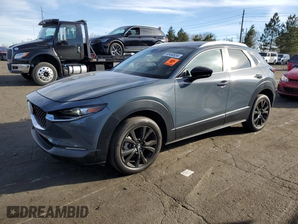 2023 Mazda CX-30 S Carbon Edition z VIN 3MVDMBCM5PM512410, wystawiony jako Copart lot #83490034 z przebiegiem 23 783 mil mil oraz Nie do naprawy • Non repairable. Historia ofert i sprzedaży dostępna na DreamBid. Obrazek 1.