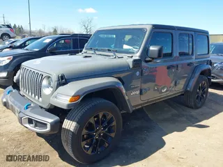 2023 Jeep Wrangler 4xe Sahara with VIN 1C4JJXP62PW696002, listed as a IAAI auction lot 41891127 with 44,567 mi miles. Bid and sale history available at carsss.com. Image 17.