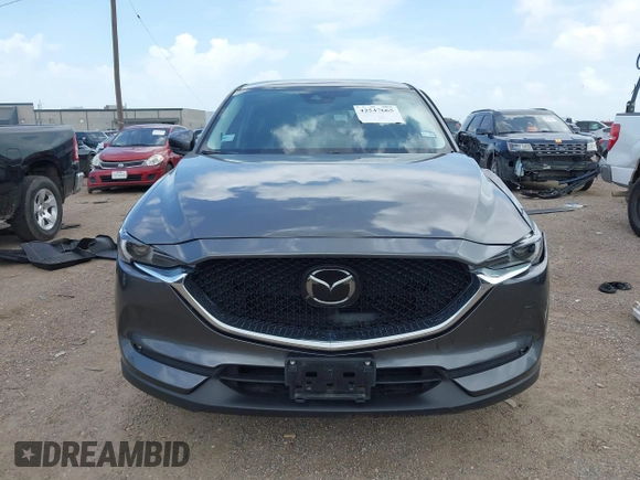 2021 Mazda CX-5 Grand Touring with VIN JM3KFBDM2M0431484, listed as a IAAI auction lot 42547665 with 34,757 mi miles and . Bid and sale history available at DreamBid. Image 13.