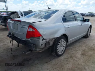 2012 Ford Fusion Hybrid с VIN 3FADP0L36CR426322, выставлен на аукционе IAAI как лот 42592635 с пробегом 151 941 миль миль и . История ставок и продаж доступна на DreamBid. Изображение 4.