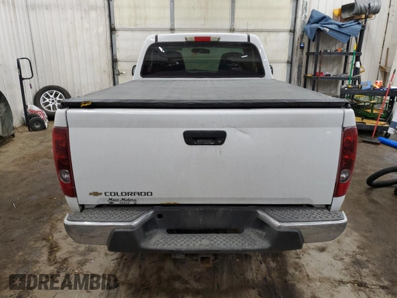 2006 Chevrolet Colorado Work Truck z VIN 1GCCS148268238603, wystawiony jako Copart lot #41386645 z przebiegiem 150 781 mil mil oraz Szkoda całkowita • Salvage title. Historia ofert i sprzedaży dostępna na DreamBid. Obrazek 6.