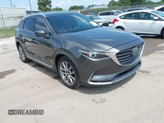 2016 Mazda CX-9 Signature with VIN JM3TCBEY9G0100579, listed as a IAAI auction lot 42282293 with 142,700 mi miles and . Bid and sale history available at DreamBid. Image 1.