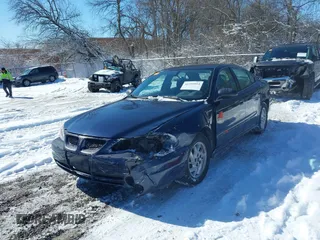 2004 Pontiac Grand Am SE with VIN 1G2NE52F24M692805, listed as a IAAI auction lot 41591014 with 137,072 mi miles. Bid and sale history available at carsss.com. Image 2.