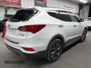 2017 Hyundai Santa Fe Ultimate with VIN 5NMZW4LA0HH040141, listed as a IAAI auction lot 42603243 with 140,817 mi miles and . Bid and sale history available at DreamBid. Image 4.