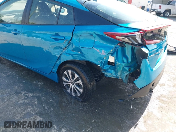 2021 Toyota Prius LE with VIN JTDKAMFP7M3180504, listed as a IAAI auction lot 41985409 with 56,617 mi miles and . Bid and sale history available at DreamBid. Image 6.