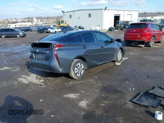 2018 Toyota Prius Two z VIN JTDKARFU4J3056141, wystawiony jako IAAI lot #41525929 z przebiegiem 127 414 mil mil oraz . Historia ofert i sprzedaży dostępna na DreamBid. Obrazek 4.