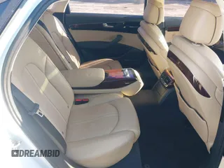 2014 Audi A8 3.0T z VIN WAURGAFDXEN006902, wystawiony jako IAAI lot #41099662 z przebiegiem 118 734 mil mil oraz . Historia ofert i sprzedaży dostępna na DreamBid. Obrazek 5.