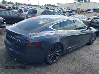 2014 Tesla Model S P85D with VIN 5YJSA1H29EFP63032, listed as a IAAI auction lot 42132145 with Not Provided miles and . Bid and sale history available at DreamBid. Image 4.