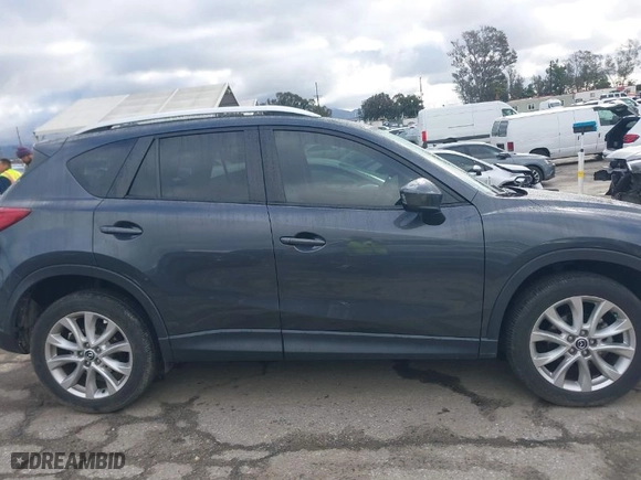 2014 Mazda CX-5 Grand Touring with VIN JM3KE2DY3E0361940, listed as a IAAI auction lot 41708680 with 99,719 mi miles. Bid and sale history available at carsss.com. Image 13.