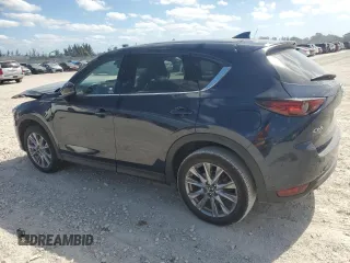 2021 Mazda CX-5 Grand Touring with VIN JM3KFADM1M0301366, listed as a Copart auction lot 52890955 with 66,686 mi miles and Non Repairable. Bid and sale history available at carsss.com. Image 2.