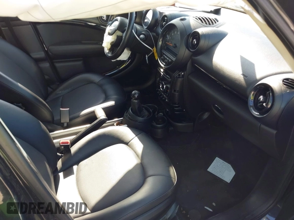 2015 MINI Countryman with VIN WMWZB3C54FWM33074, listed as a IAAI auction lot 42094992 with 86,704 mi miles and . Bid and sale history available at DreamBid. Image 5.