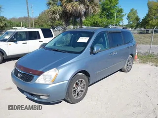 2014 Kia Sedona EX with VIN KNDMH4C70E6553732, listed as a IAAI auction lot 41812283 with 676,894 mi miles. Bid and sale history available at carsss.com. Image 2.