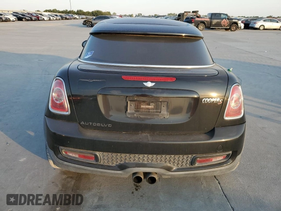 2013 MINI Coupe S z VIN WMWSX3C57DT408719, wystawiony jako Copart lot #75440574 z przebiegiem Nie podano mil oraz Szkoda całkowita • Salvage title. Historia ofert i sprzedaży dostępna na DreamBid. Obrazek 6.
