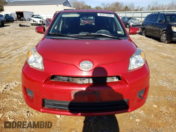 2012 Scion xD with VIN JTKKU4B45C1025911, listed as a Copart auction lot 84477054 with 102,953 mi miles and Salvage Title. Bid and sale history available at DreamBid. Image 5.