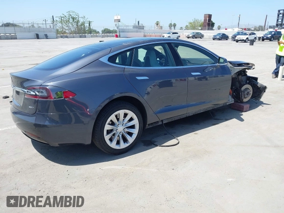 2016 Tesla Model S 90D with VIN 5YJSA1E22GF138236, listed as a IAAI auction lot 42532245 with 72,839 mi miles and . Bid and sale history available at DreamBid. Image 4.
