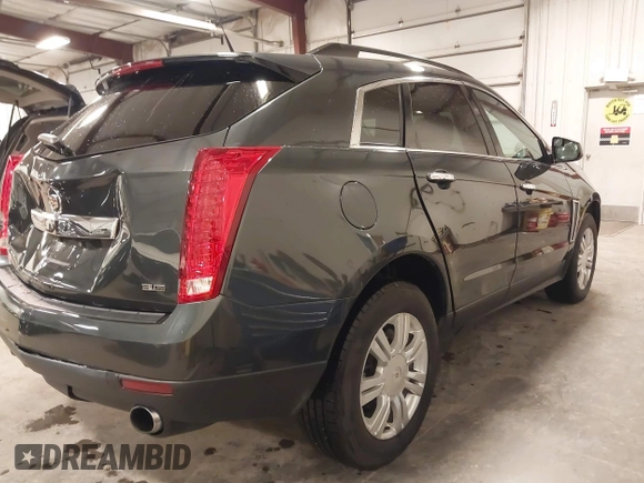 2014 Cadillac SRX with VIN 3GYFNAE34ES665630, listed as a IAAI auction lot 41315281 with 99,009 mi miles and . Bid and sale history available at DreamBid. Image 4.
