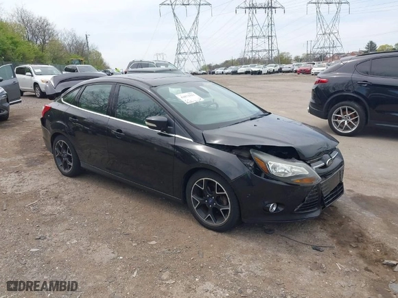 2012 Ford Focus Titanium with VIN 1FAHP3J2XCL369554, listed as a IAAI auction lot 42072931 with 95,474 mi miles. Bid and sale history available at carsss.com. Image 1.