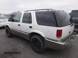 1999 GMC Jimmy SLE with VIN 1GKDT13W1X2551085, listed as a Copart auction lot 50553055 with 189,974 mi miles and Salvage Title. Bid and sale history available at carsss.com. Image 2.