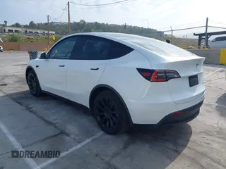 2021 Tesla Model Y Long Range with VIN 5YJYGDEE0MF069451, listed as a IAAI auction lot 41482649 with 55,542 mi miles. Bid and sale history available at carsss.com. Image 3.