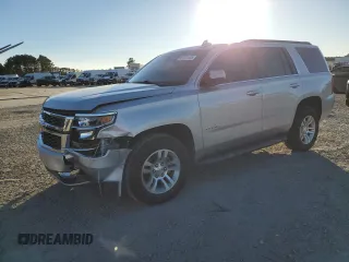 2015 Chevrolet Tahoe LS with VIN 1GNSCAKC1FR643336, listed as a Copart auction lot 47523105 with 113,656 mi miles and Salvage title. Bid and sale history available at DreamBid. Image 1.