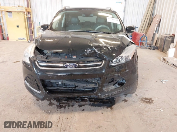 2016 Ford Escape Titanium with VIN 1FMCU0JX3GUB70607, listed as a IAAI auction lot 41727421 with 106,857 mi miles. Bid and sale history available at carsss.com. Image 6.