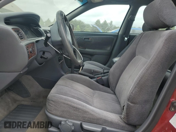 1998 Toyota Camry LE z VIN JT2BG22K6W0179063, wystawiony jako Copart lot #56998295 z przebiegiem 251 129 mil mil oraz Szkoda całkowita • Salvage title. Historia ofert i sprzedaży dostępna na DreamBid. Obrazek 7.