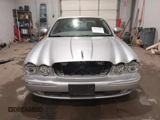 2004 Jaguar XJ with VIN SAJWA71C04SG33993, listed as a IAAI auction lot 41193040 with 79,944 mi miles. Bid and sale history available at carsss.com. Image 12.