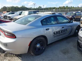 2021 Dodge Charger Police with VIN 2C3CDXAT8MH643477, listed as a IAAI auction lot 40688118 with 59,555 mi miles and . Bid and sale history available at DreamBid. Image 4.