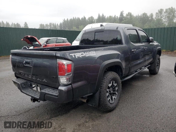 2020 Toyota Tacoma SR5 with VIN 3TMDZ5BN2LM097782, listed as a Copart auction lot 61573465 with 57,321 mi miles and Salvage title. Bid and sale history available at DreamBid. Image 3.