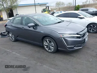 2018 Honda Clarity Plug-In Hybrid with VIN JHMZC5F14JC017006, listed as a IAAI auction lot 42064754 with 36,976 mi miles. Bid and sale history available at carsss.com. Image 1.