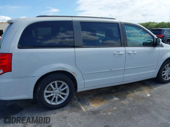 2014 Dodge Grand Caravan SXT with VIN 2C4RDGCGXER322705, listed as a IAAI auction lot 42170301 with 147,070 mi miles and . Bid and sale history available at DreamBid. Image 6.