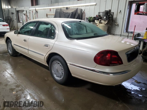 1998 Lincoln Continental with VIN 1LNFM97V9WY604317, listed as a Copart auction lot 83999234 with 91,277 mi miles and Salvage Title. Bid and sale history available at carsss.com. Image 2.