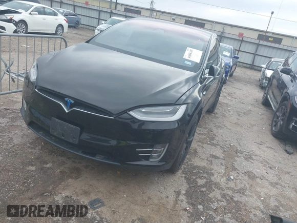 2021 Tesla Model X Long Range Plus with VIN 5YJXCAE27MF324270, listed as a IAAI auction lot 41886101 with 59,614 mi miles and . Bid and sale history available at carsss.com. Image 19.