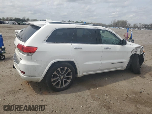2018 Jeep Grand Cherokee Overland with VIN 1C4RJFCG5JC437508, listed as a Copart auction lot 51814795 with 104,598 mi miles and Salvage title. Bid and sale history available at DreamBid. Image 3.