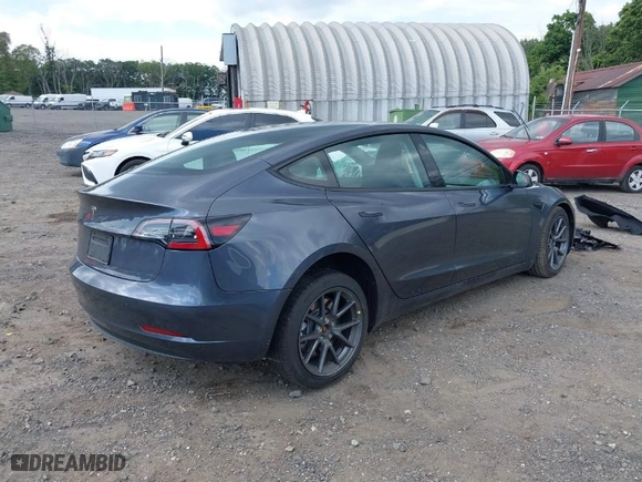 2023 Tesla Model 3 with VIN 5YJ3E1EA3PF494324, listed as a IAAI auction lot 39964499 with 12,501 mi miles. Bid and sale history available at carsss.com. Image 4.